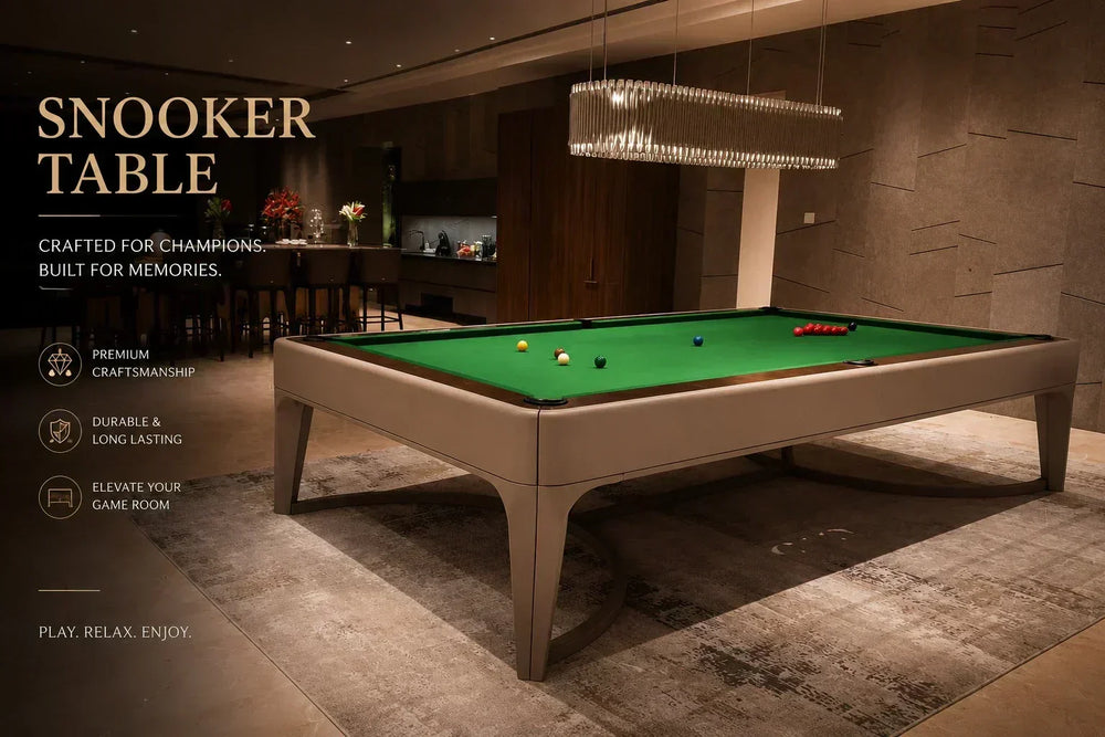 ARGMAC Negrosno snooker table in taupe with curved, bracket legs, green cloth topped with snooker balls and snooker accessories, lit by an oval crystal chandelier in a warm lounge.